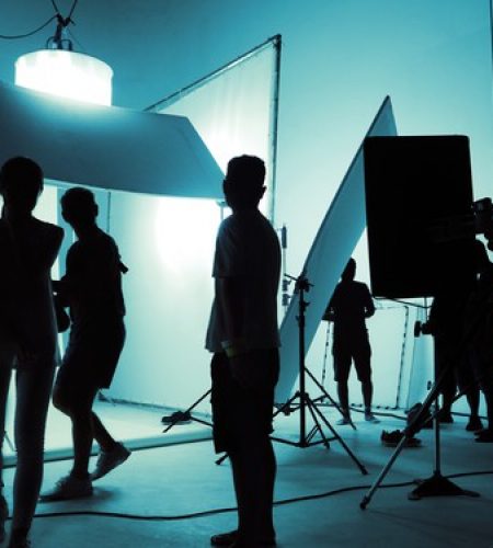 shooting-studio-photographer-creative-art-director-with-production-crew-team-setting-up-lighting-flash-led-headlight-tripod-professional-equipment-portrait-model-photo-shoot_258335-52